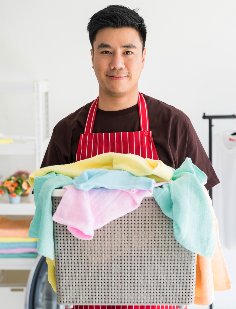 A person holding a laundry basket